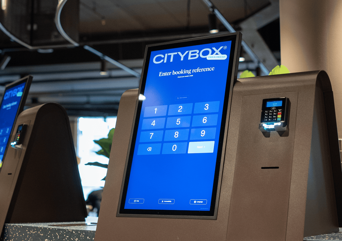 Close-up of Citybox self check-in kiosk with Beetronics touchscreen and card reader.