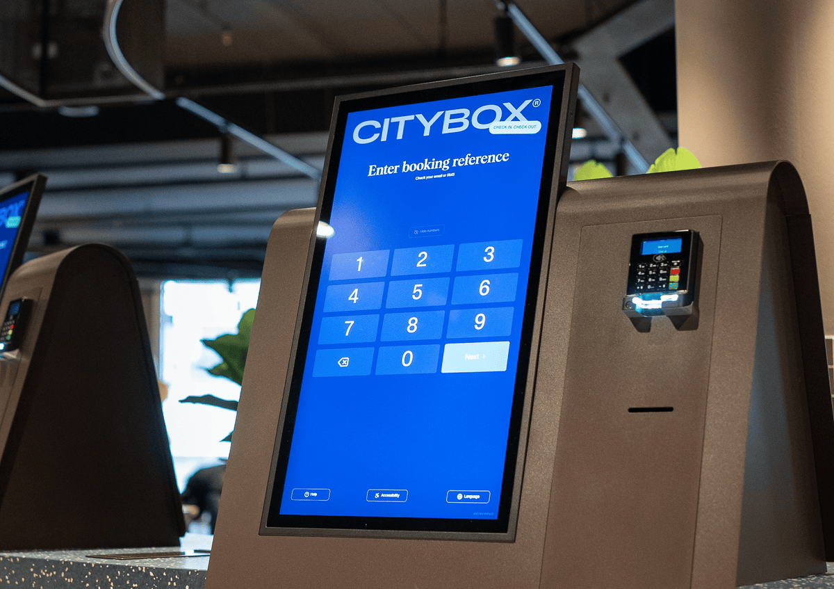 Close-up of Citybox self check-in kiosk with Beetronics touchscreen and card reader.