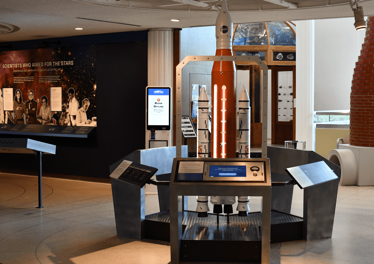 Rocketry museum exhibit with panel-mounted Beetronics touchscreen stations.