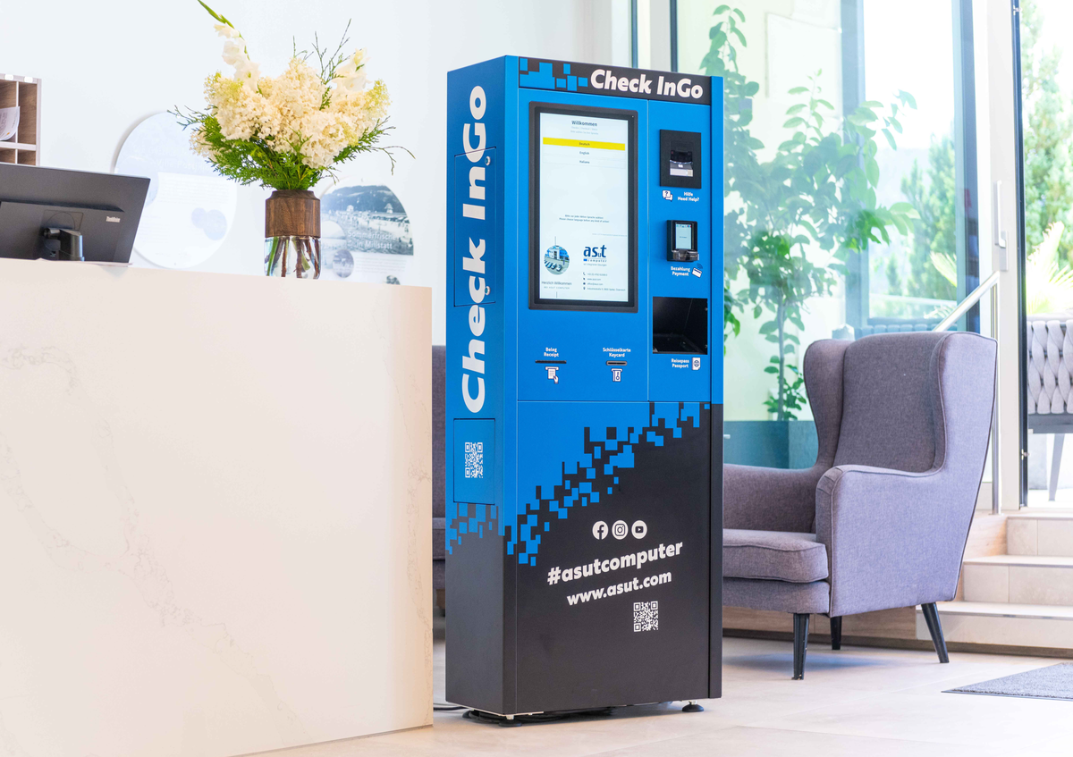 Compact hotel self-service check-in kiosk with Beetronics touchscreen, designed for 24/7 unattended operation.