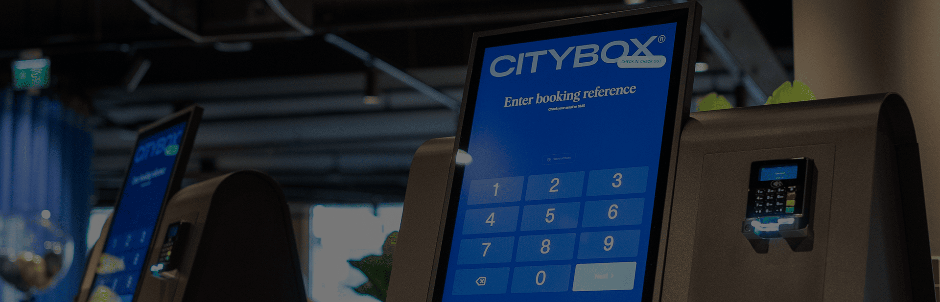 Close-up of Citybox self check-in kiosk with Beetronics touchscreen and card reader.